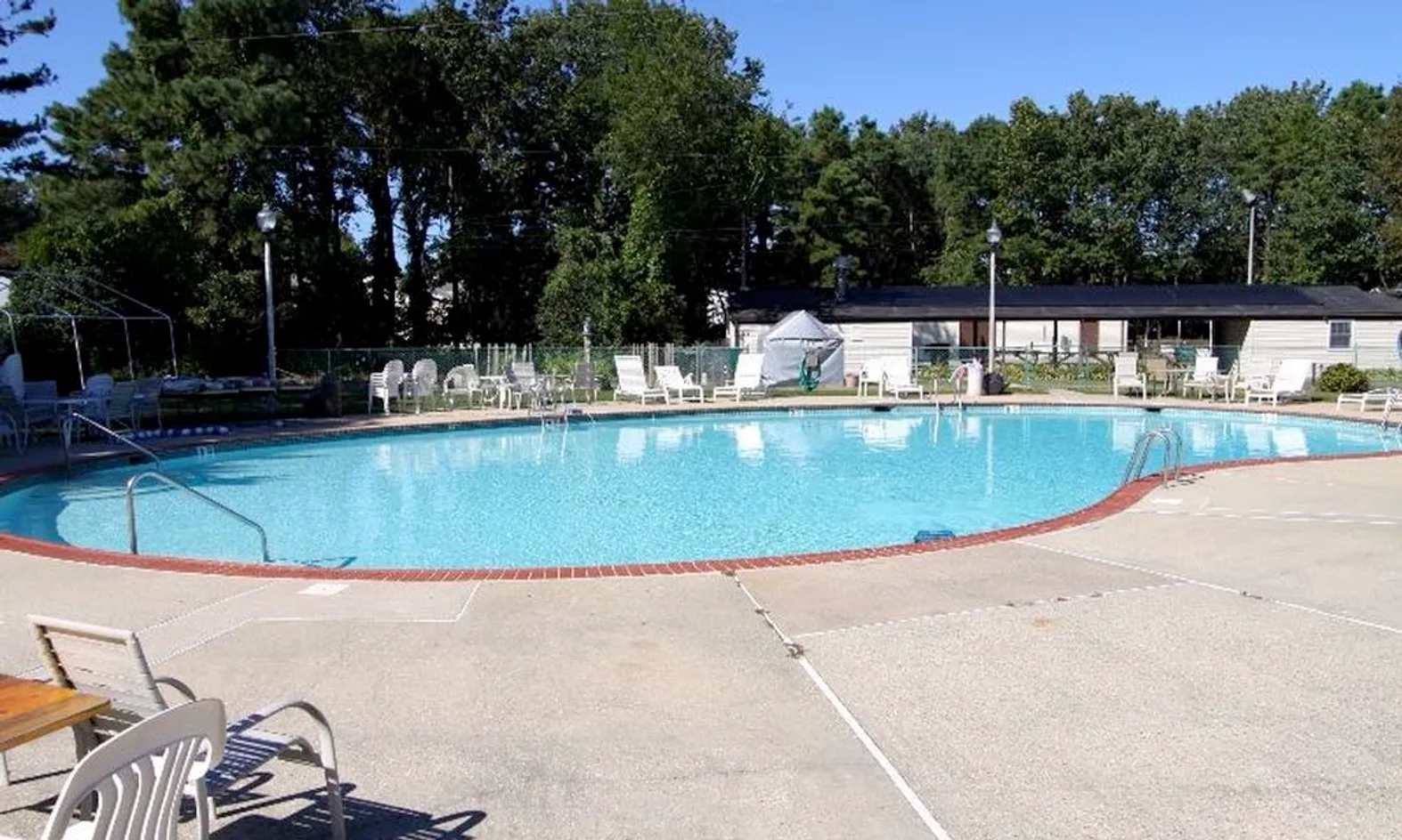Outdoor heated swimming pool with lounge chairs at Lions Head North